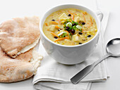 Mediterranean lemon chicken soup with pita bread