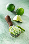 Lime ice cream in an ice cream scoop