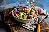 Bowl of?ready-to-eat?salad with spinach?falafel