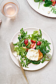 Arugula salad with grilled chicken, burrata and fresh strawberries