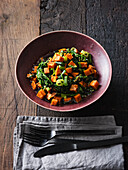 Sweet potato salad with spinach, sesame seeds, soy sauce and mirin