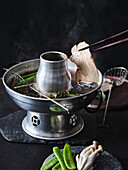 Korean broth fondue with pork belly and vegetables