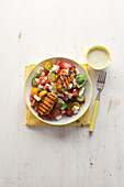 Grilled chicken steaks with summer tomato salad with blue cheese