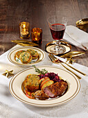 Goose schnitzel on red cabbage with napkin dumplings for Christmas