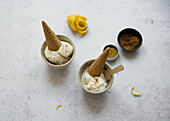 Lemon ice cream served with ice cream cones in small bowls