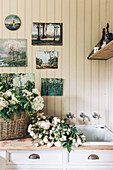 Vintage paintings decorates the laundry room