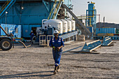 Oilfield workers transferring cement