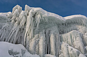 Ice stalactites along the bank of Tornetrask Lake, Sweden