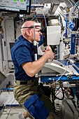 Alexander Gerst, ESA astronaut, performing eye exam