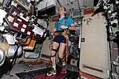 Cosmonaut Ryazanskiy running on a treadmill