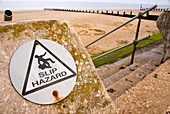 Slip hazard warning sign