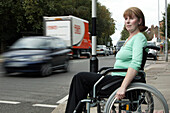 Wheelchair user crossing road