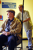 Elderly patient being pushed in a wheelchair