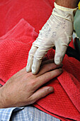 Patient information on paramedic's glove