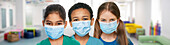 Schoolchildren wearing face masks