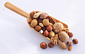 Wooden scoop with different kinds of nuts