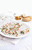 Creamy goat's cheese with chives and pomegranate seeds