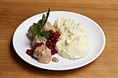 Meatballs, creamed mash and redcurrants