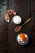 Greek yogurt with apricots and pomegranate seeds