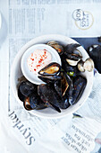 Oven baked mussels with spicy dip