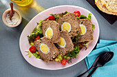 Meatloaf with egg (fake rabbit) on salad
