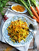 Vegan vegetable rice with curry powder and sultanas