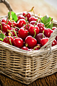 Fresh cherries in a wicker basket