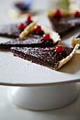 Chocolate tart garnished with currants