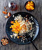 Millet with mango and roasted almonds