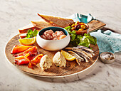 An appetizer platter with fish and seafood