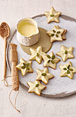 Pistachio stars with orange butter icing