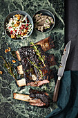 Sous-Vide short ribs in a herb rub with celery and pomegranate salad