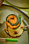 Courgette rolls with tomato hummus