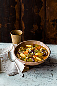 Vegan pointed cabbage and bean minestrone with polenta dumplings