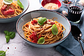 Spaghetti al pomodoro, topped with spiced yeast flakes and basil, vegan