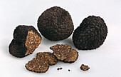 Truffles and truffle slices on a white background