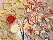 Decorating Christmas cookies, with red and white icing