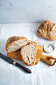 Cutting a loaf of sourdough bread