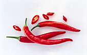 Chilies and chili rings on a white background