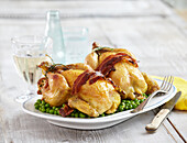 Stuffed spring chickens with peas