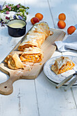 Apricot strudel with curd and vanilla sauce