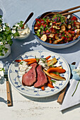 Roast beef with roasted carrots and Bavarian pretzel salad