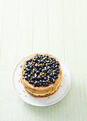 Blueberry and pistachio cake with cardamom cream