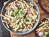 Sausage salad with radishes and chives