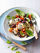 Mediterranean salad with orzo, tofu, and olives