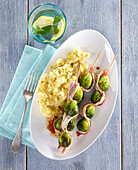 Brussels sprout and bacon skewers with potato mash