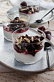 Healthy dessert with cream cheese, cherry preserves, chocolate and almonds