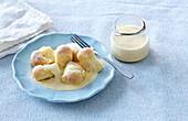 Sweet dumplings (mini buns) with vanilla sauce