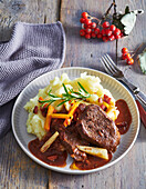 Roast fallow deer braised in red wine with mashed potatoes
