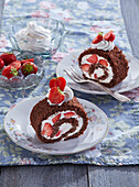 Cocoa roll with whipped cream and strawberries